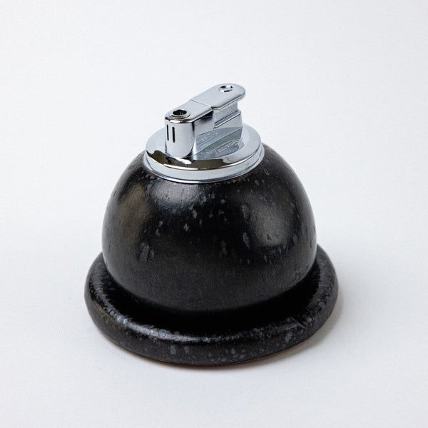 satin black ashtray with table lighter. handmade ceramic pebble table lighter in satin black. maison ko x olivia snow ceramics