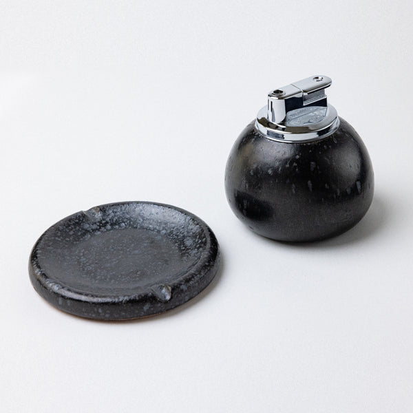 satin black ashtray with table lighter. handmade ceramic pebble table lighter in satin black. maison ko x olivia snow ceramics