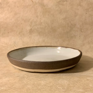 wide low bowl. dark brown and white.
