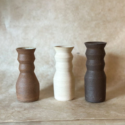 medium angled handmade ceramic vases in 3 colors; brown, white and dark brown.
